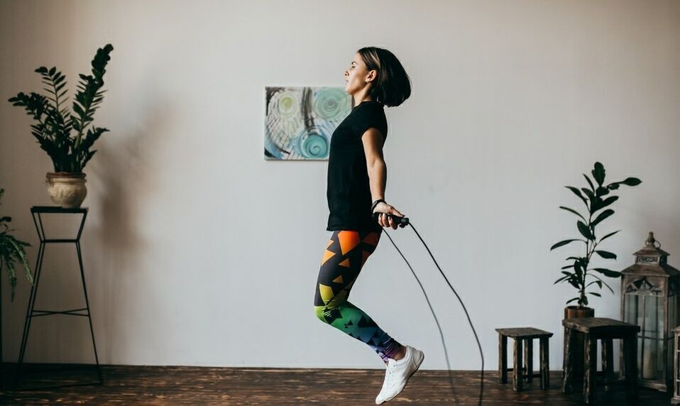 a girl doing an exercise with a skipping rope