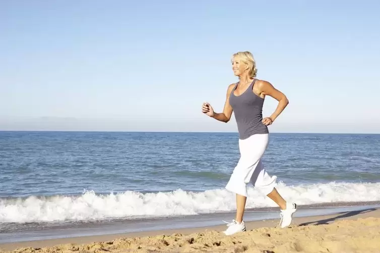 A woman in her old age jogs for weight loss and good heart function