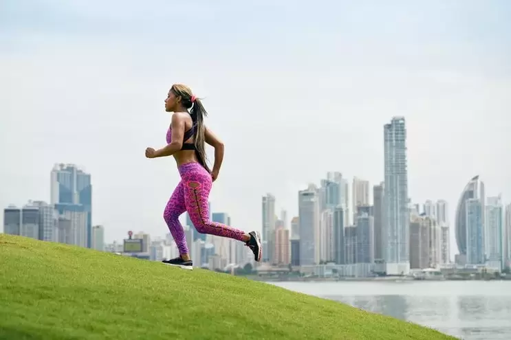 The girl follows the rules of breathing depending on the running technique